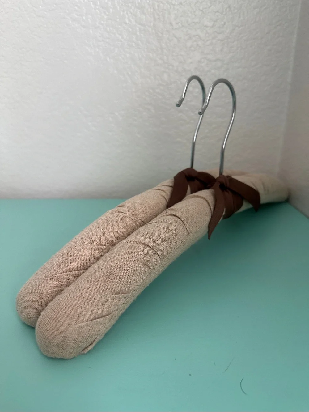 Linen padded heavy duty hangers set of 2ct.-beige color with a bow-brand new.